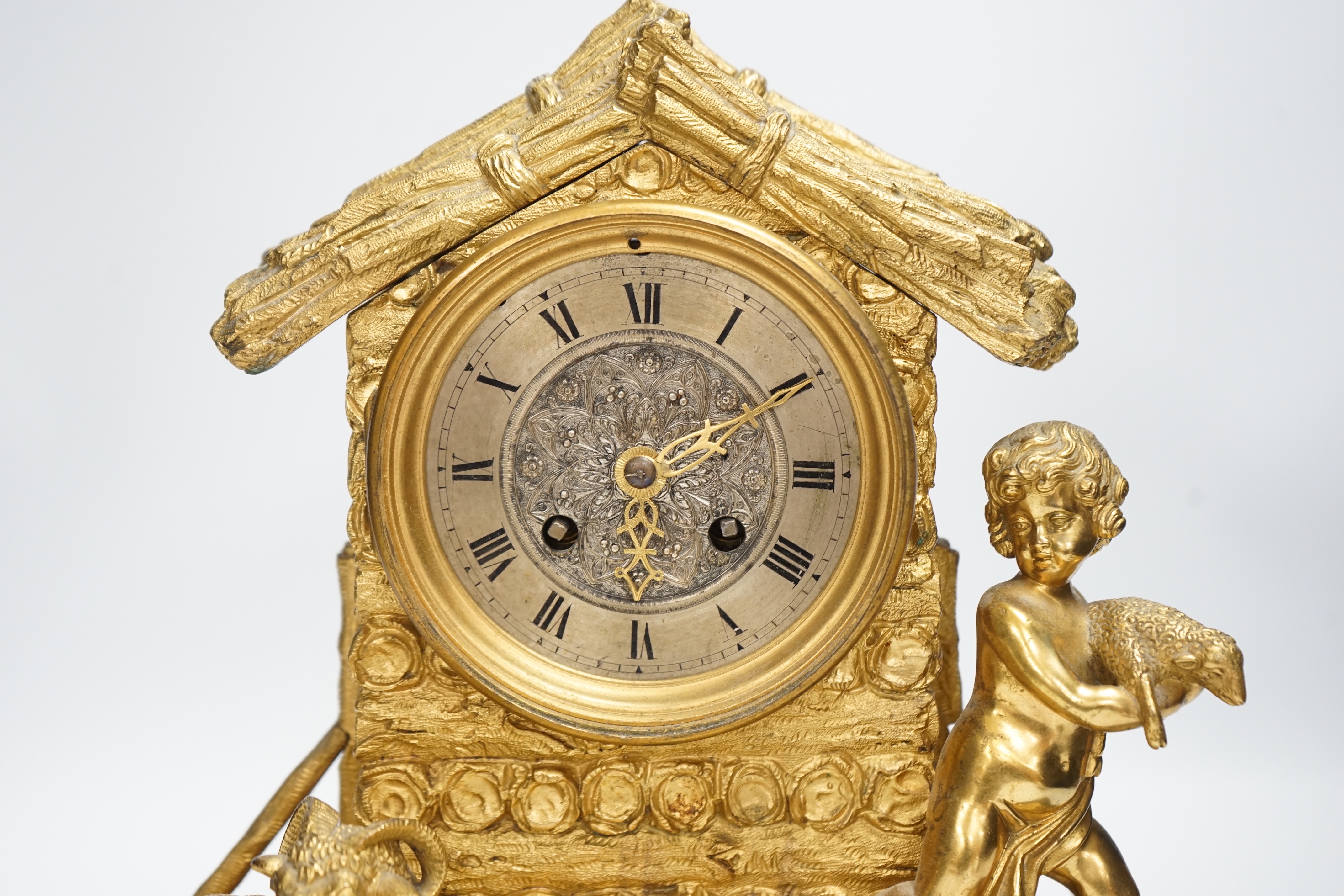 A 19th century ormolu clock, Richard & Cie stamped movement, case formed as a log cabin with child and sheep figural group, 30cm high